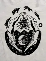 Detail of the In Cycles print on a off-white T-shirt