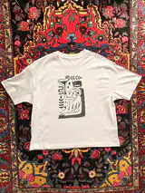 Detail of the Me Time print on a off-white T-shirt