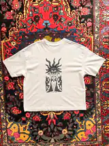 Detail of the New Sight print on a off-white T-shirt
