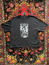 Detail of the Sacred Dance print on a black T-shirt