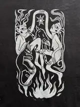 Detail of the Sacred Dance print on a black T-shirt