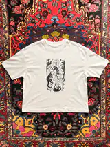 Detail of the Sacred Dance print on a off-white T-shirt