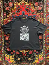Detail of the Seed of Change print on a black T-shirt
