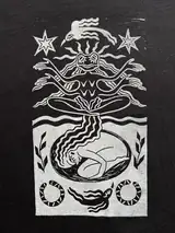 Detail of the Seed of Change print on a black T-shirt
