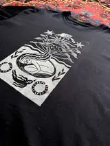 Close-up of the hand-pressed Seed of Change print on cotton