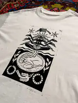Close-up of the hand-pressed Seed of Change print on cotton