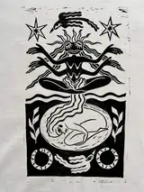 Detail of the Seed of Change print on a off-white T-shirt