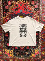 Detail of the In Embrace of Thoughts print on a off-white T-shirt